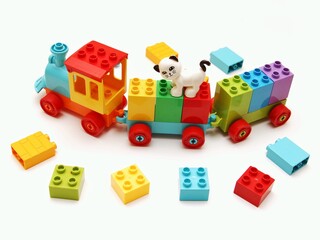train constructor, plastic building blocks on a white background.  educational toy for kids