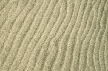 Beautiful wavy beach sand close up