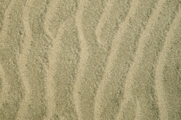 Beautiful wavy beach sand close up