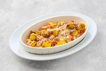 Casserole with chicken, pumpkin, bell pepper and potatoes