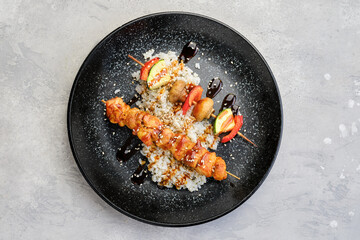 Top view of shashlik with chicken and grilled champignon with bell pepper and zucchini