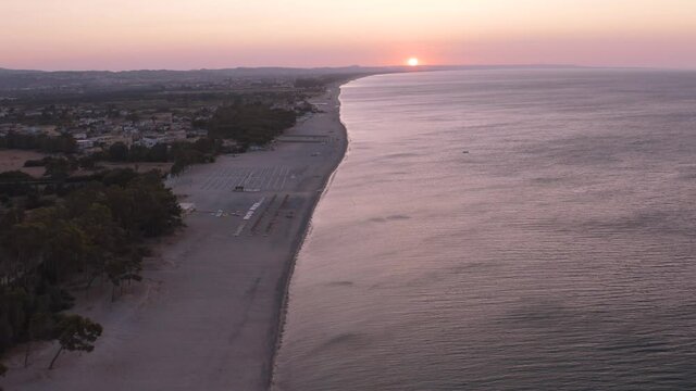 Aerial view of beautiful mediterranean sea and beach at sunrise, seascape of Calabria,  Simeri Mare, Southern Italy