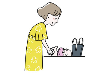 外出先で赤ちゃんのおむつを変えている女性