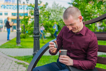 Happy office worker opening delicious and hot coffee during lunch