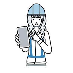 立ってスマートフォンを指差してこちらに向けて見せている工事現場の女性
