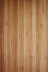 Fototapeta premium Wood texture background of a bamboo laundry basket. Top view of small wooden boards. Light brown surface with natural color.