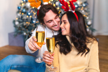 Happy couple celebrating Christmas at home