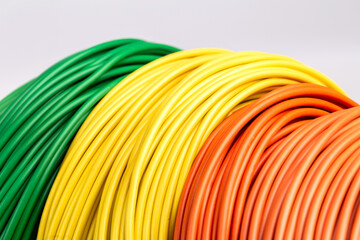 Colored cable, energy and technology electrical equipment, isolated on gray background.