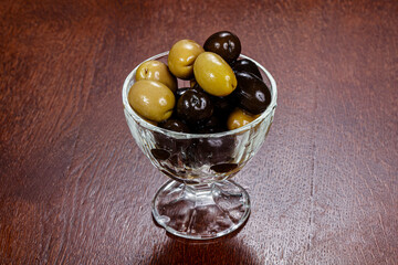 Green and black olives in the bowl