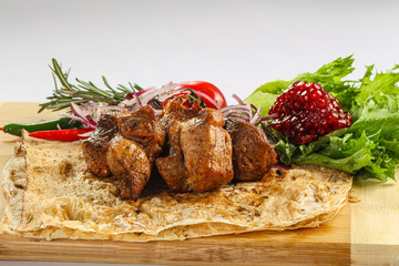 Pork meat shashlik served salad