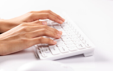 Close-up woman's hand typing on keyboard computer, business woman working in the office.