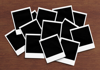 Stack of instant photos Mockup. Pile of retro photographs on wooden 3D rendering