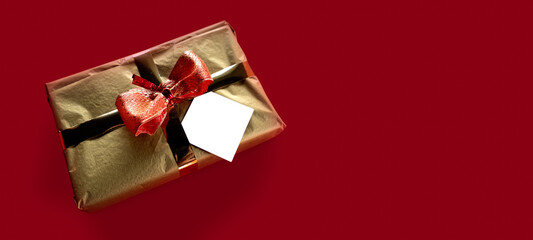 Christmas gift card red background. Advertising and creative concept with empty space for copy.