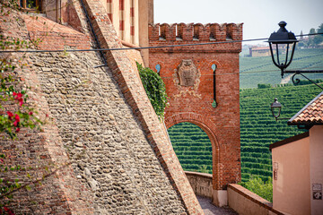 Medieval castle and street  of Barolo, Piemonte, Langhe wine district and Uneso heritage, Italy with view of vineyards