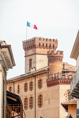 Medieval castle of Barolo, Piemonte, Langhe wine district and Uneso heritage, Italy with Italian flag, vertical