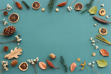 Top view image of autumn forest natural composition over green background .Flat lay