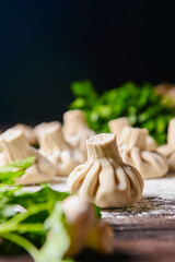 Georgian dumpling or Khinkali. Georgian homemade khinkali on wooden background.