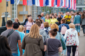 Crowd of people on the street. Summer day