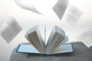 surreal flight of book pages in the sky; concept of freedom of thought