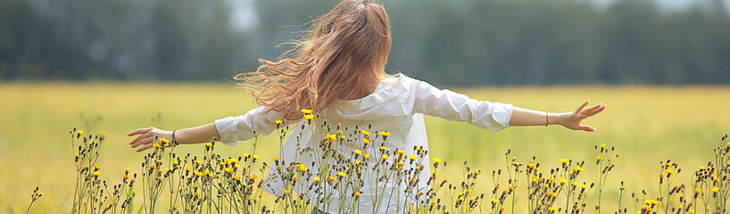 happy girl in autumn field with spikelets landscape / adult young girl portrait, summer look, nature