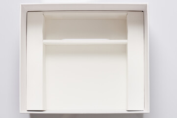 Open white box with compartment