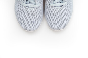 part of gray sports sneakers on a white background. adidas