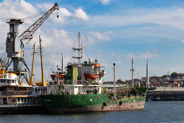 Fototapeta premium Old ship at the docks of the harbor