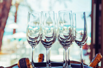 Glass of champagne on the beach.