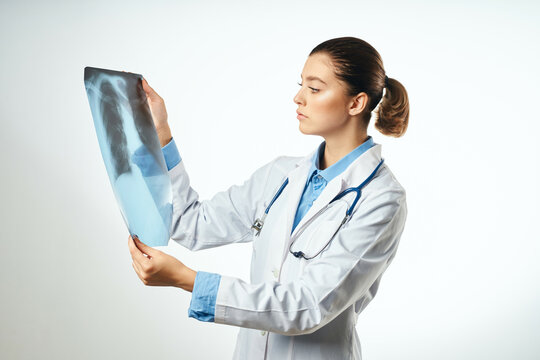 female doctor looking at x-ray professional hospital examination