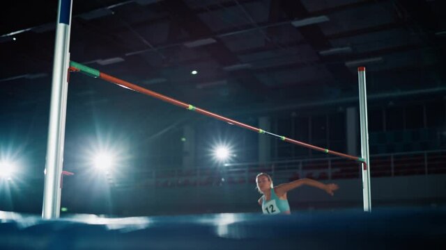 High Jump Championship Championship: Professional Female Athlete Running with Jumping over Bar. Determination, Endurance, Motivation, Effort of Champion in Training. Slow Motion Cinematic Shot