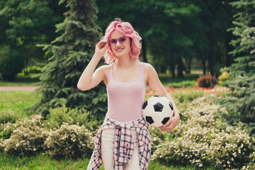 Photo of young sportive girl happy positive smile hold soccer ball player game park nature hand...