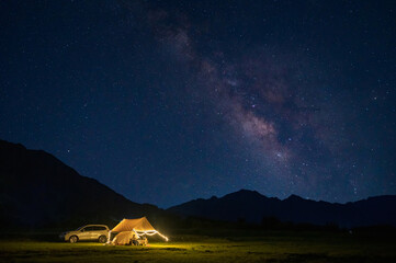 Tent under the stars at night