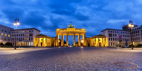 Fototapeta na wymiar Berlin Brandenburger Tor Gate in Germany at night blue hour copyspace copy space panorama