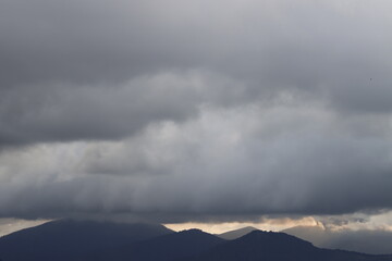 Naklejka na ściany i meble Clouds over the mountains