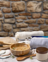 Eco friendly reusable accessories and natural organic cosmetics for skin and body care with stone wall behind