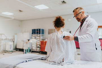 Physician listening to the lungs of a patient