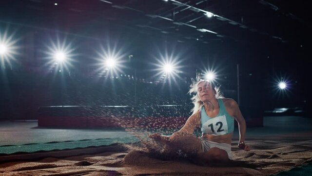 Long Jump Championship: Professional Female Athlete Running on Track and Distance Jumping. Determination, Motivation, Inspiration of a Successful Sports Woman Celebrating Record Result. Slow Motion