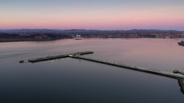 Aerial: Oil refinery pier in San Pablo Bay. Oakland, USA