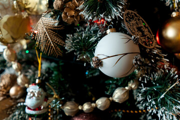Obraz na płótnie Canvas Decorated Christmas tree with balls, beads, baubles.