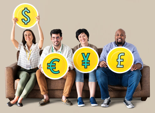 Diverse people holding currency icons