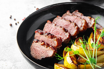 duck breast and garnish second course side dish fresh portion ready to eat meal snack on the table copy space food background rustic. top view keto or paleo diet