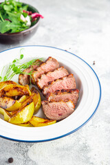 duck breast and garnish second course side dish fresh portion ready to eat meal snack on the table copy space food background rustic. top view keto or paleo diet