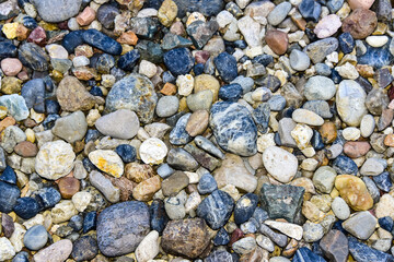 Flat lay of sea stones texture background. Abstract shape pattern from nature.