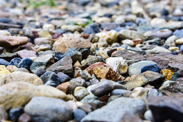 Rocks sea beach or stones background, Many small stones in assorted colors, Abstract rough wallpaper nature concept
