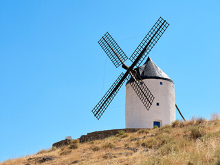 The windmills of Consuegra, located on Colle Calderico, on a sunny day in summer.