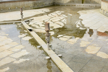 Disconnected fountain. Fountain without water.