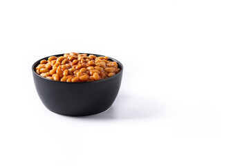 White beans in tomato sauce in bowl isolated on white background. Copy space