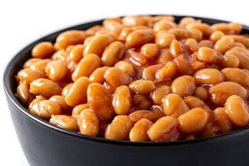 White beans in tomato sauce in bowl isolated on white background. Close up