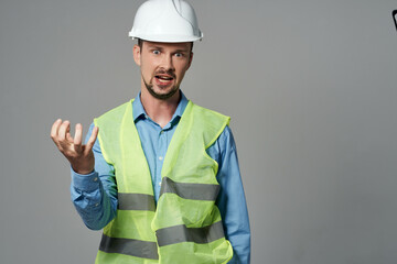 man reflective vest protection Working profession light background