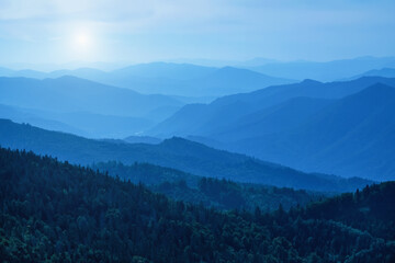 Panorama of dark blue mountain landscape. Horizontal image.
